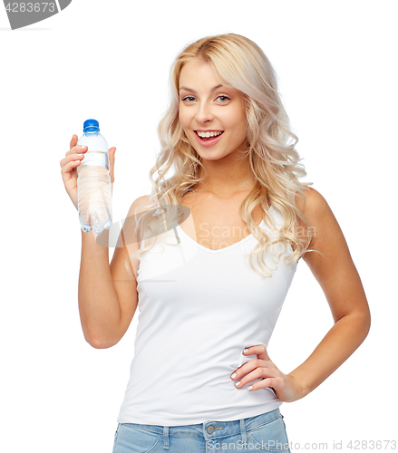 Image of happy beautiful young woman with bottle of water