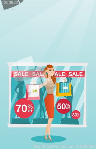 Image of Young caucasian woman shopping on sale.