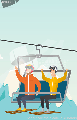 Image of Two caucasian skiers using cableway at ski resort.