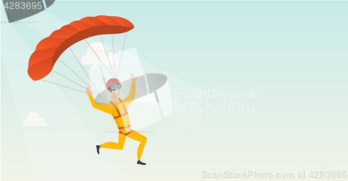 Image of Young caucasian skydiver flying with a parachute.