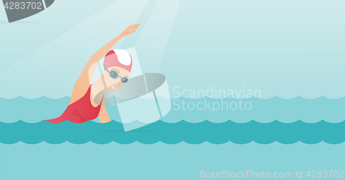 Image of Young caucasian sportswoman swimming.