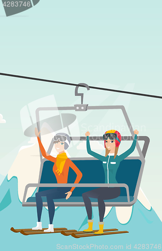 Image of Two caucasian skiers using cableway at ski resort.