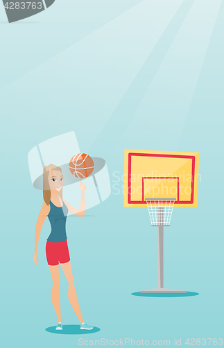 Image of Young caucasian basketball player spinning a ball.