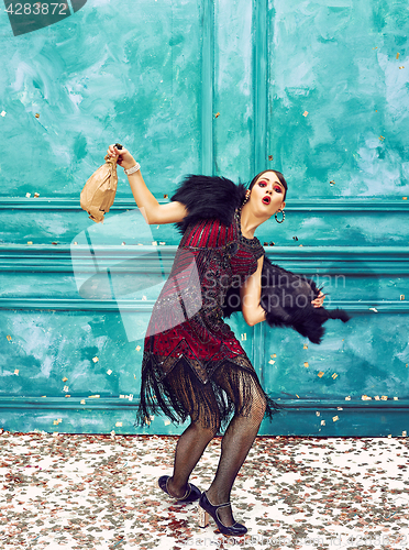 Image of The studio shot of woman as retro dancer