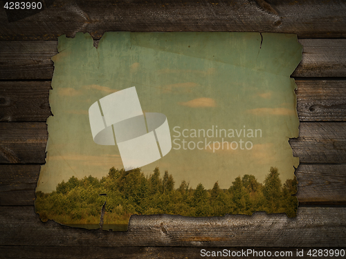 Image of ancient photo at wooden wall