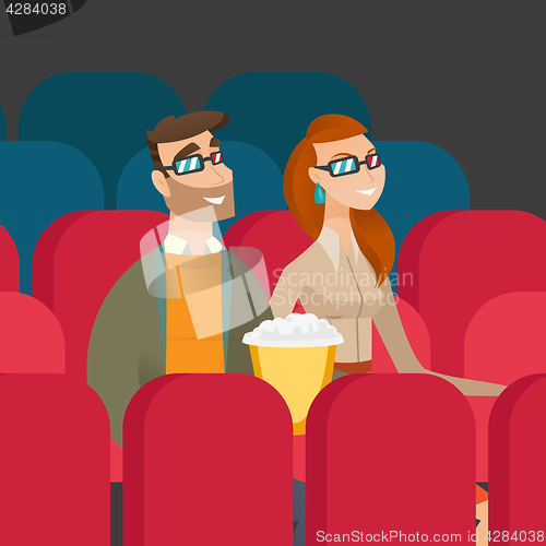 Image of Caucasian couple watching 3D movie in the theatre.