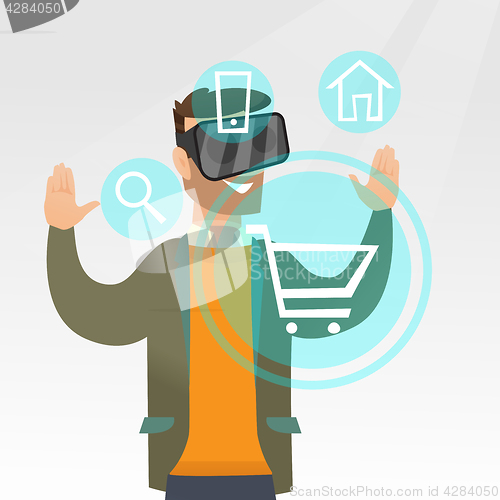 Image of Man in virtual reality headset shopping online.