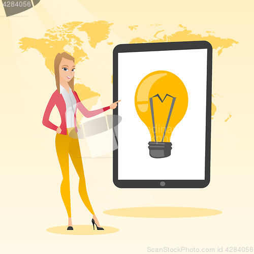 Image of Caucasian woman pointing at a big tablet computer.
