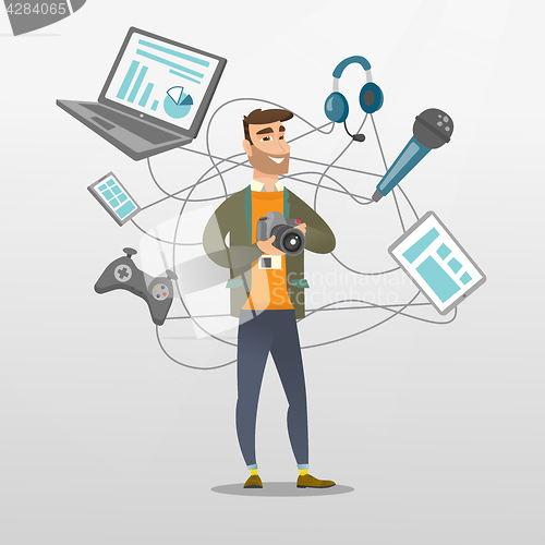 Image of Young caucasian man surrounded by her gadgets.