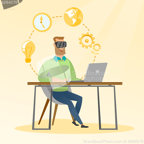 Image of Businessman in vr headset working on a computer.