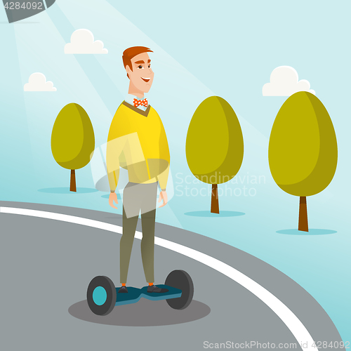 Image of Man riding on self-balancing electric scooter.