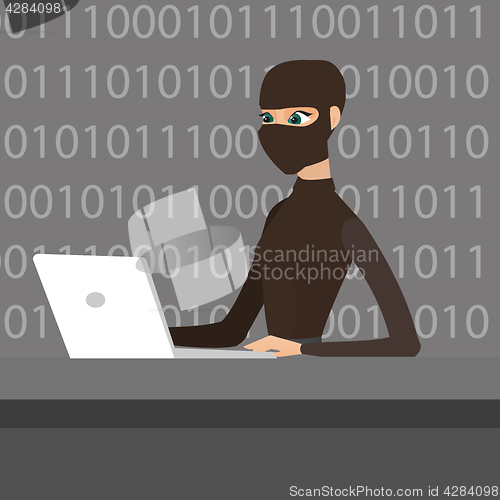 Image of Hacker using laptop to steal information.