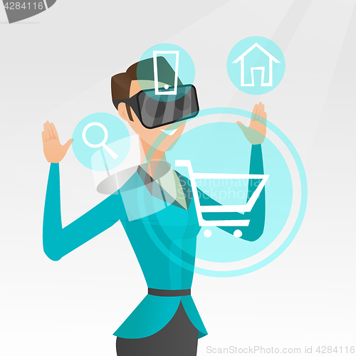 Image of Woman in virtual reality headset shopping online.