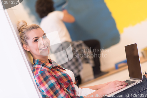 Image of Happy couple doing home renovations