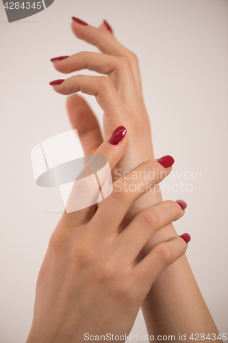 Image of closeup of hands of a young woman