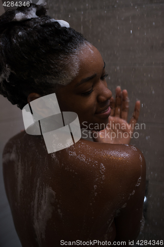Image of African American woman in the shower