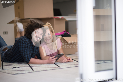 Image of Young couple moving in a new flat