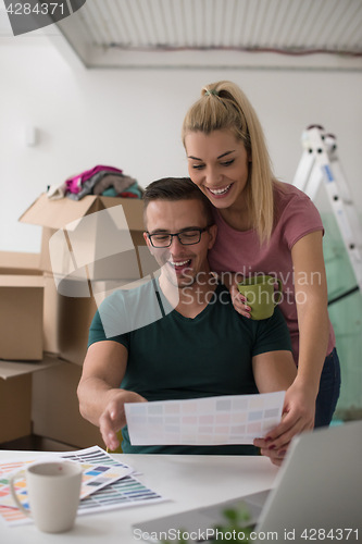 Image of Young couple moving in a new home