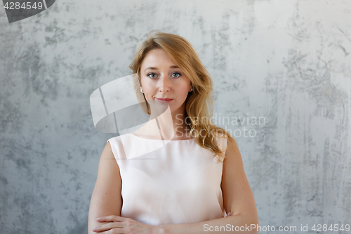 Image of Long -haired beautiful girl in dress