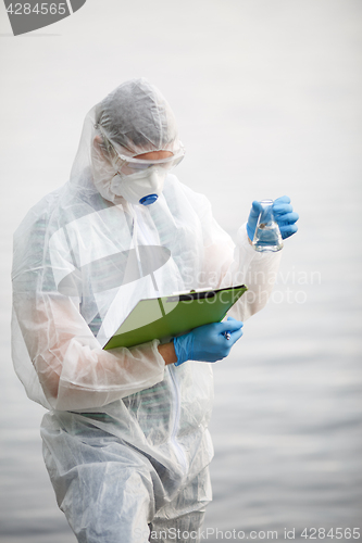 Image of Ecologist with bulb and folder