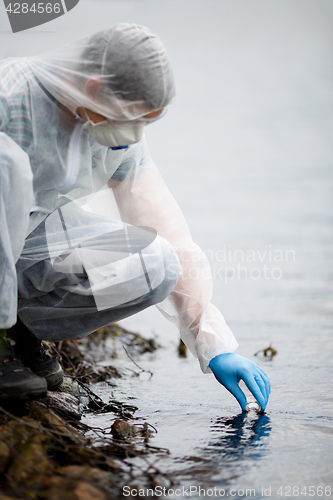 Image of Lab assistant with test tube