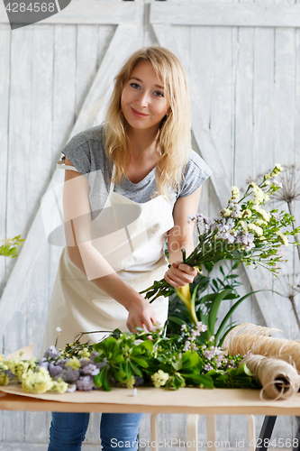 Image of Florist blonde in flower shop