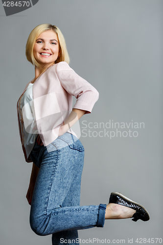 Image of Girl raised leg in studio