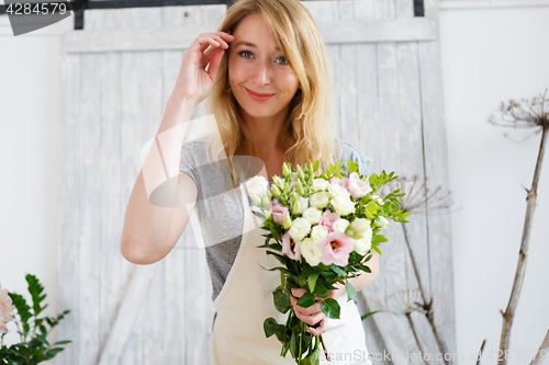 Image of Portrait of woman with bouquet