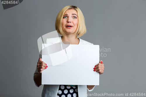 Image of Photo of woman with paper