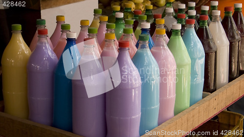 Image of Bottles with colorful drinks. shallow dof