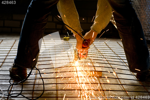 Image of Construction worker with Angle Grinder