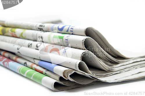 Image of Newspapers folded and stacked