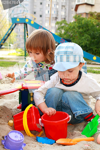 Image of Two kids in a sandbox