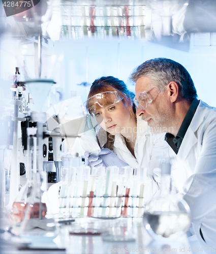 Image of Health care researchers working in scientific laboratory.