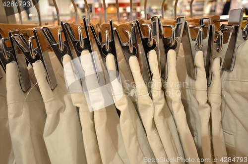 Image of Designer clothes hanger in a row 