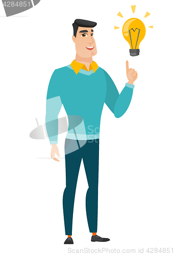 Image of Businessman pointing at business idea light bulb.