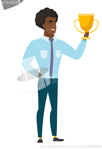 Image of Caucasian business man holding a trophy.