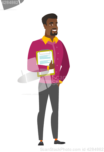 Image of Businessman holding clipboard with documents.