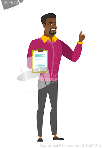 Image of Businessman with clipboard giving thumb up.