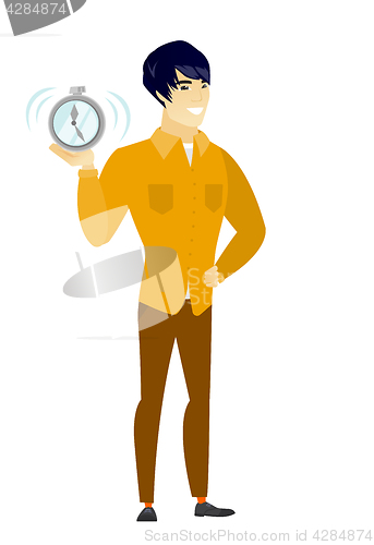 Image of Asian business man holding alarm clock.