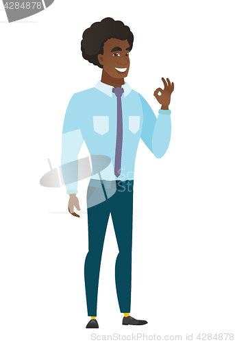 Image of Smiling businessman showing ok sign.