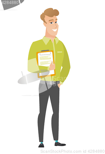 Image of Businessman holding clipboard with documents.
