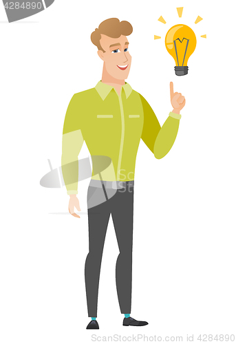 Image of Businessman pointing at business idea light bulb.
