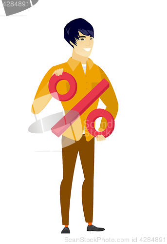 Image of Smiling businessman holding percent sign.