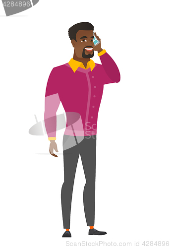 Image of Businessman talking on a mobile phone.