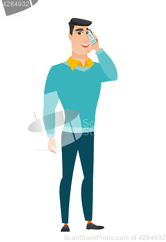 Image of Businessman talking on a mobile phone.