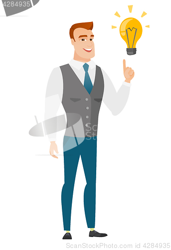 Image of Businessman pointing at business idea light bulb.