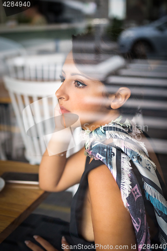 Image of Woman in Cafe