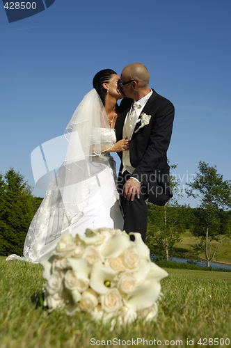 Image of Wedding couple kissing