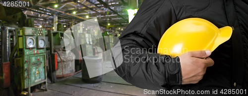 Image of Worker with safety helmet